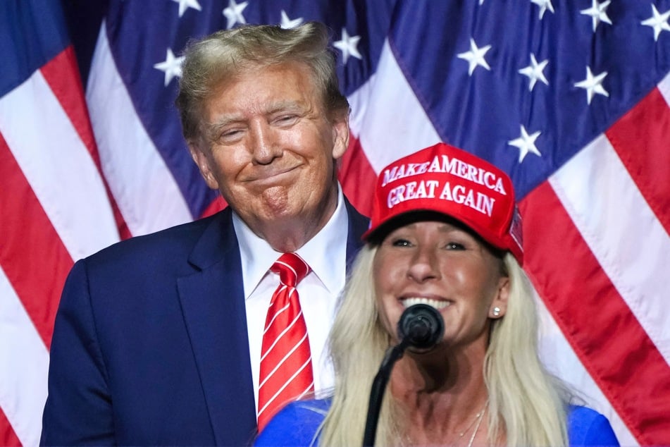 Representative Marjorie Taylor Greene (R) speaking alongside 2024 presidential candidate Donald Trump at a campaign event in Rome, Georgia on March 9, 2024.