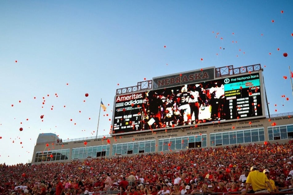 Nebraska fans have released red balloons after the Cornhuskers score their first touchdown of the game at Memorial Stadium for 50 years running.