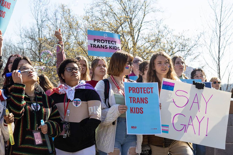 Teens from around the state gather in front of the Kentucky Capitol Annex building in Frankfort to protest the ban on gender-affirming health care for minors.