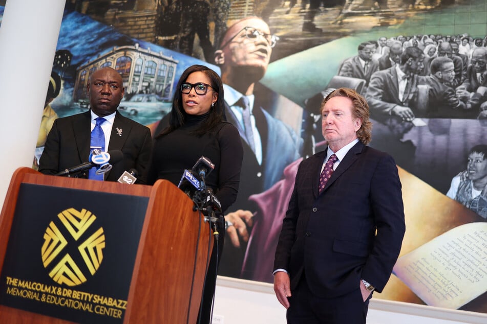 Attorney Ben Crump (L), Malcolm X’s daughter Ilyasah Shabazz (C,) and special advisor to the Shabazz Center Ron Baldwin (R) address the press calling for the declassification of documents of Malcolm X, during the 60th anniversary of his assassination, in Harlem, New York on Friday.