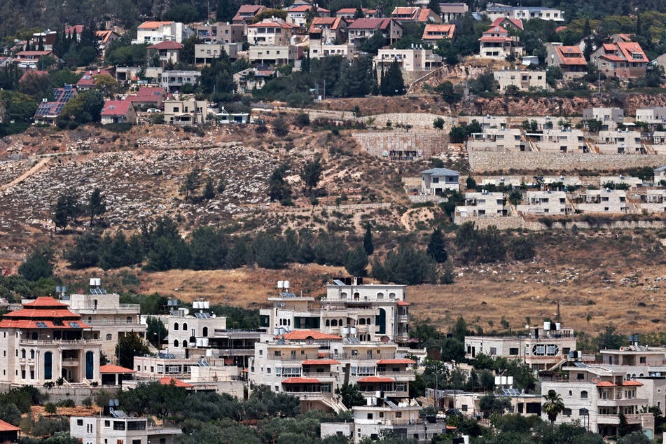 This picture shows the Palestinian village of Turmus Ayya in the occupied West Bank (foreground) and the illegal Israeli settlement of Shilo (background).