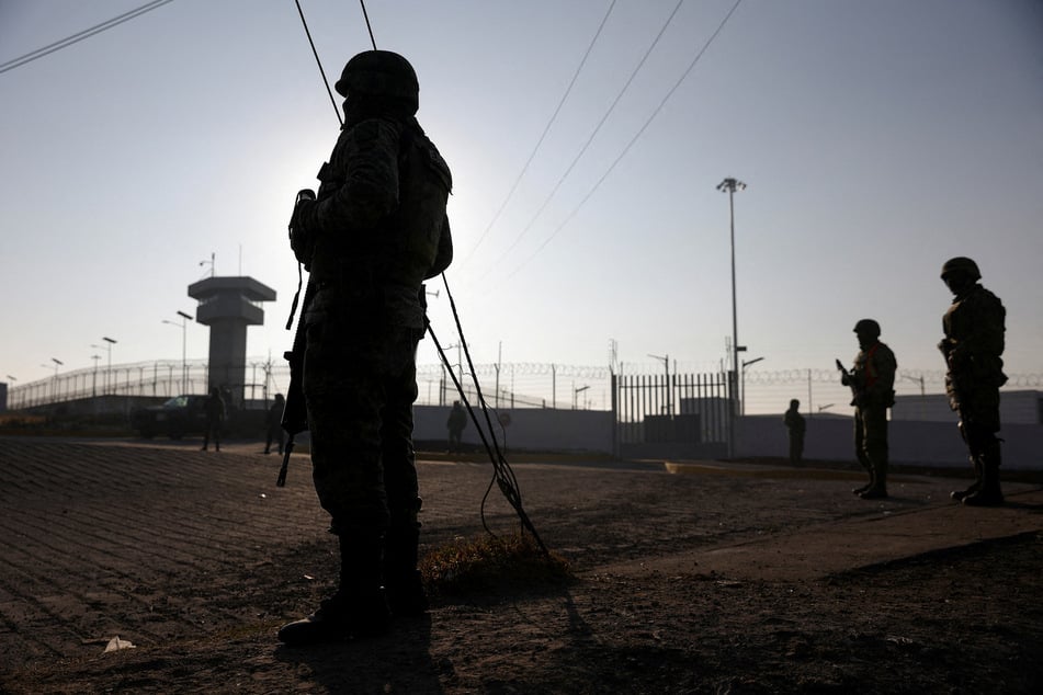 Soldiers stand outside the Altiplano high security prison where Mexican drug gang leader Ovidio Guzman was imprisoned before his extradition to the US.