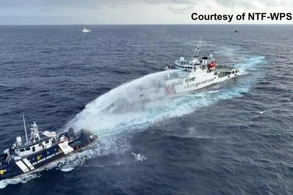 The Philippines accused the China Coast Guard of firing a water cannon at one of its vessels near the disputed Scarborough Shoal.