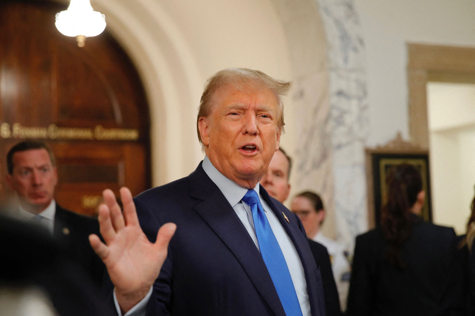 Donald Trump speaks to the media during a lunch break outside the courtroom at the New York State Supreme Court on Monday.