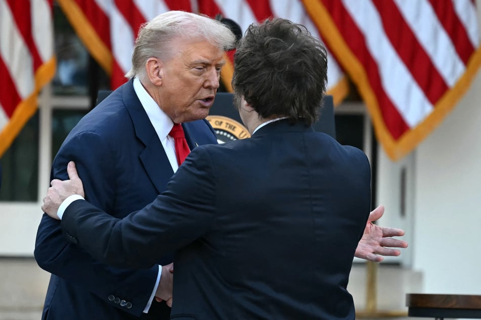 US President Donald Trump (l.) greets Argentina's President Javier Milei at the end of a Medal of Freedom Ceremony for Charlie Kirk in the Rose Garden of the White House on October 14, 2025.