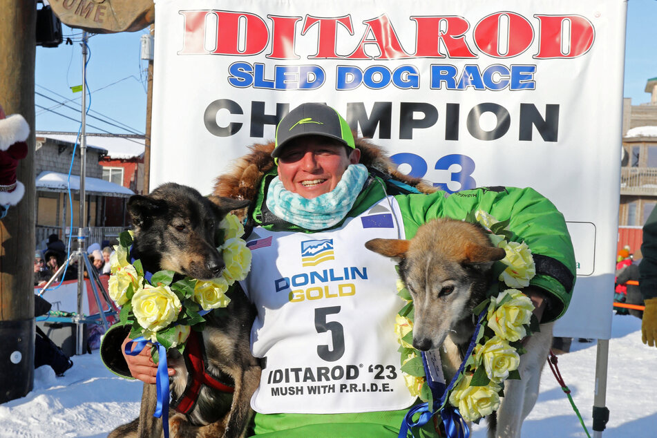 Ryan Redington at the Iditarod finish line with his dogs.