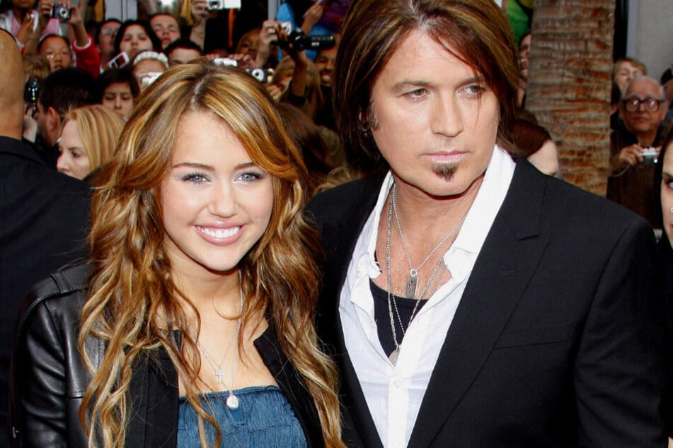 Miley Cyrus (l.) and her father Billy Ray are not speaking after a expletive audio tirade surfaced of her dad calling her a "devil" and "skank."