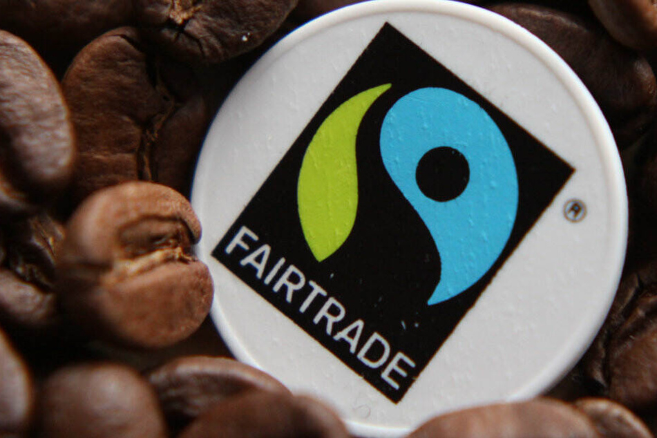 Das Fair-Trade-Logo. Der Fair-Trade-Großhandel GEPA muss sich der Hitze beugen.