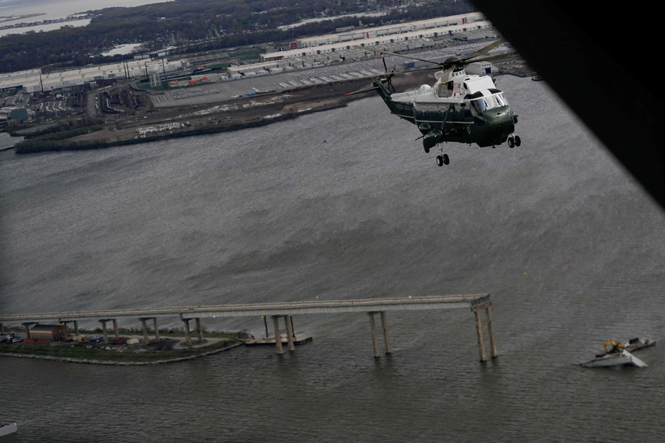 Marine One transporting President Joe Biden flies over the site of the collapsed Francis Scott Key Bridge in Baltimore, Maryland.
