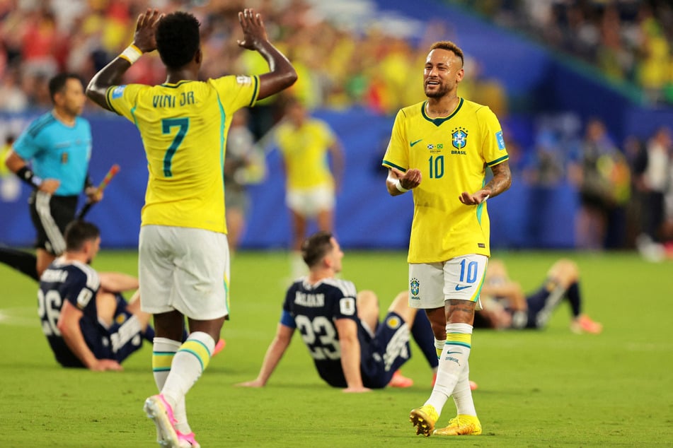 Brazil's Neymar Jr. celebrates with Vinicius Junior after their World Cup Group C match against Scotland on June 24, 2026.