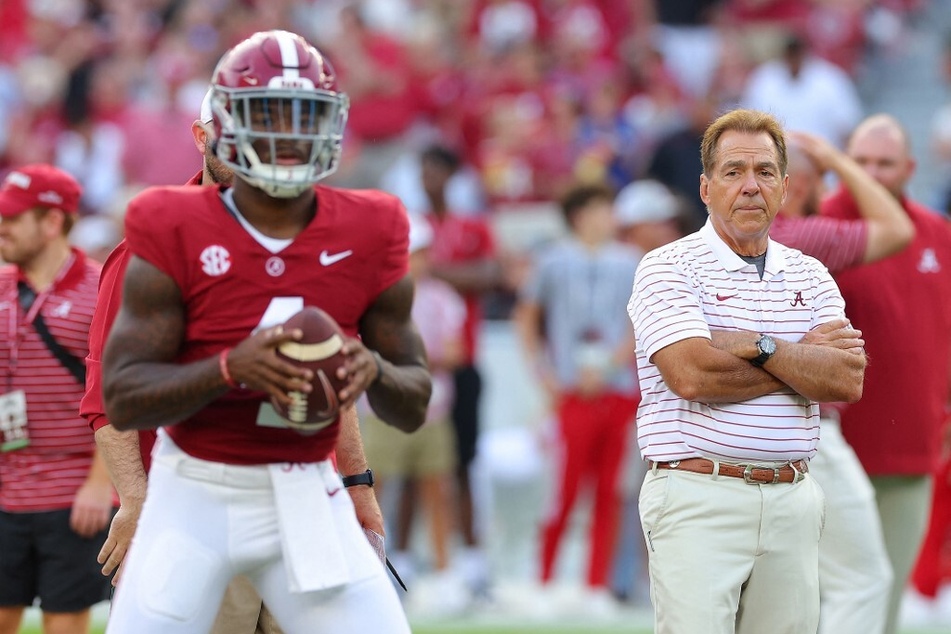 Alabama head coach Nick Saban (r.) will hope an offense led by quarterback Jalen Milroe (l.) will be too much for Michigan's defense to handle.