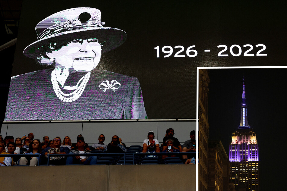 The US Open in NYC held a minute of silence and screens in tribute before its tennis match on Thursday after the death of Britain's Queen Elizabeth II. The Empire State Building (inset) was lit up in purple and silver in the monarch's memory.