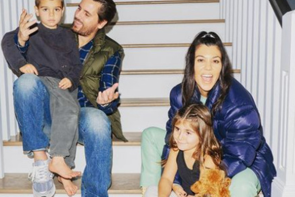 Scott Disick poses with Kourtney Kardashian and two of their children, Reign (l.) and Penelope.