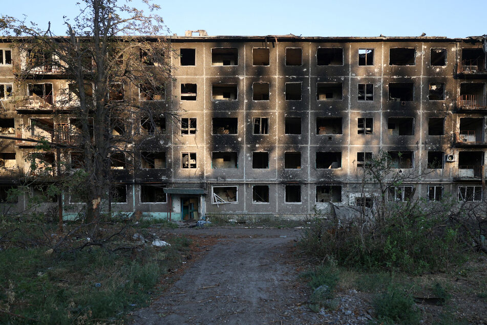 An apartment building destroyed by artillery fire is seen in the town of Chasiv Yar, Donetsk region, on July 24 amid the Russian invasion of Ukraine.