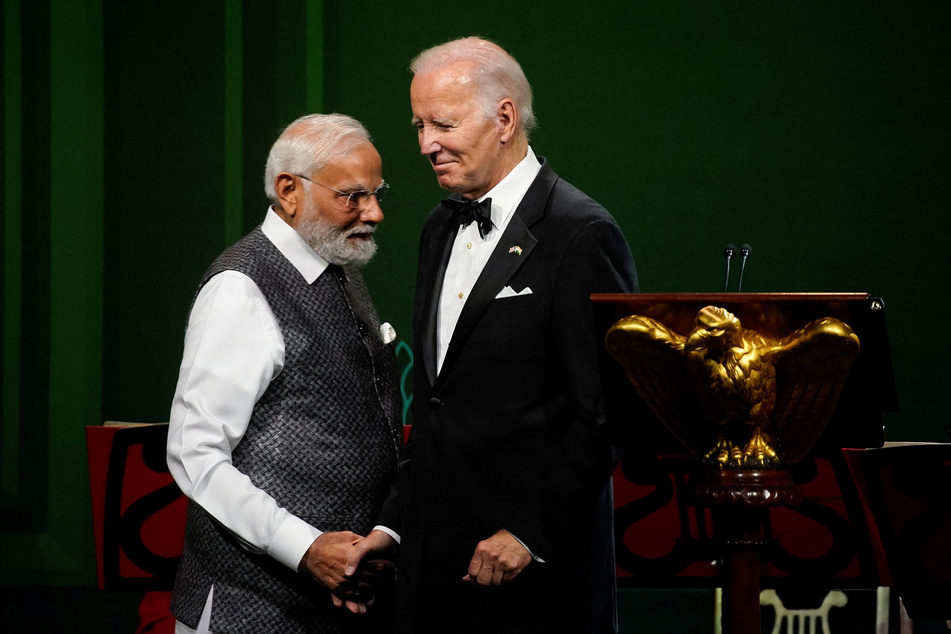 US President Joe Biden and India's Prime Minister Narendra Modi shake hands during an official state dinner at the White House.