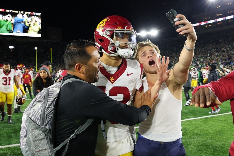 A daring fan stormed the field to taunt Caleb Williams after a tough loss to Notre Dame.