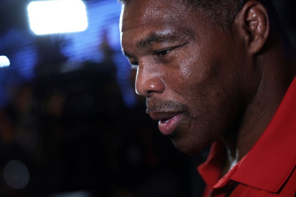 Herschel Walker is in the hot seat over reports of federal fundraising violations which could leave him vulnerable to charges of wire fraud.