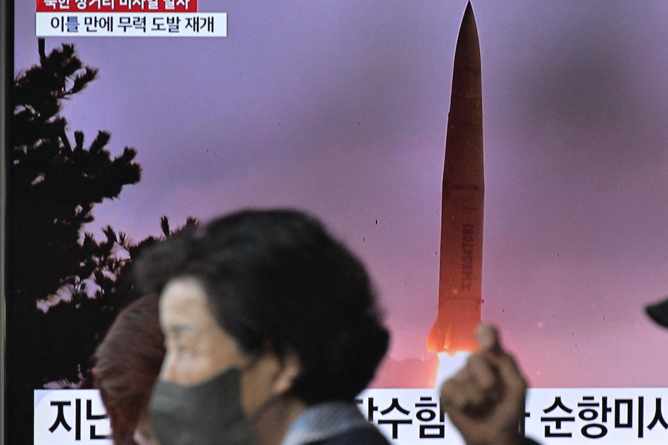 North Korea blasts off long-range ballistic missile with symbolic timing