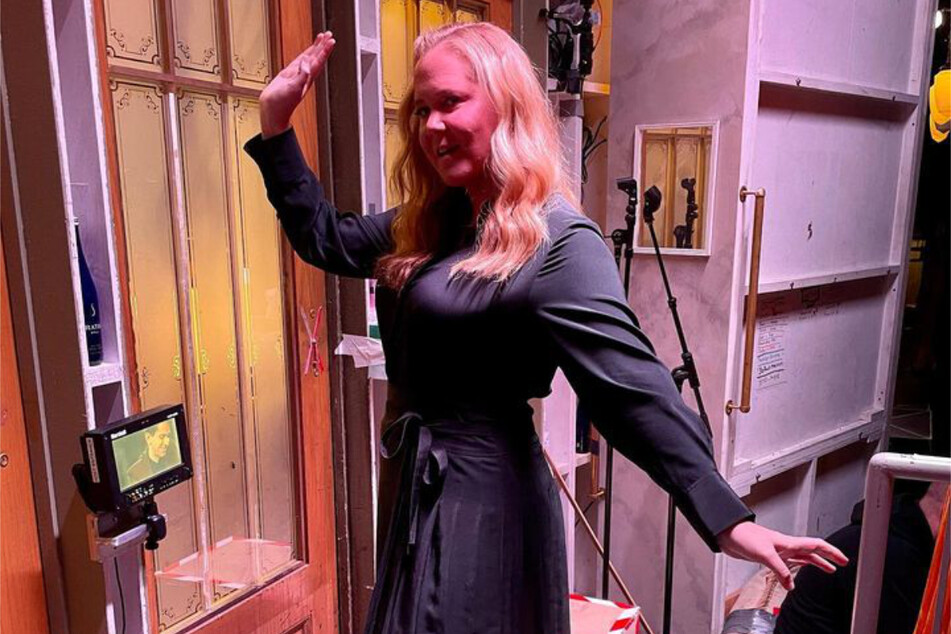 Amy Schumer shared photos of herself rehearsing on the set of Saturday Night Live before her hosting stint on Saturday, revealing it was "the hardest" because of her son's hospitalization.