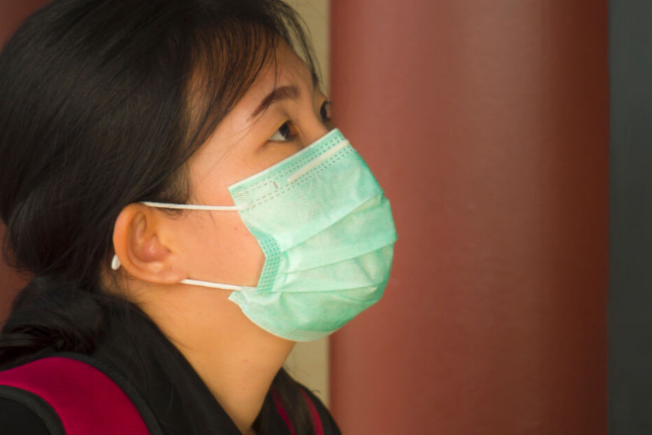 In ihrer Not behauptete die Frau, sich in Wuhan mit dem Coronavirus angesteckt zu haben. (Symbolbild)