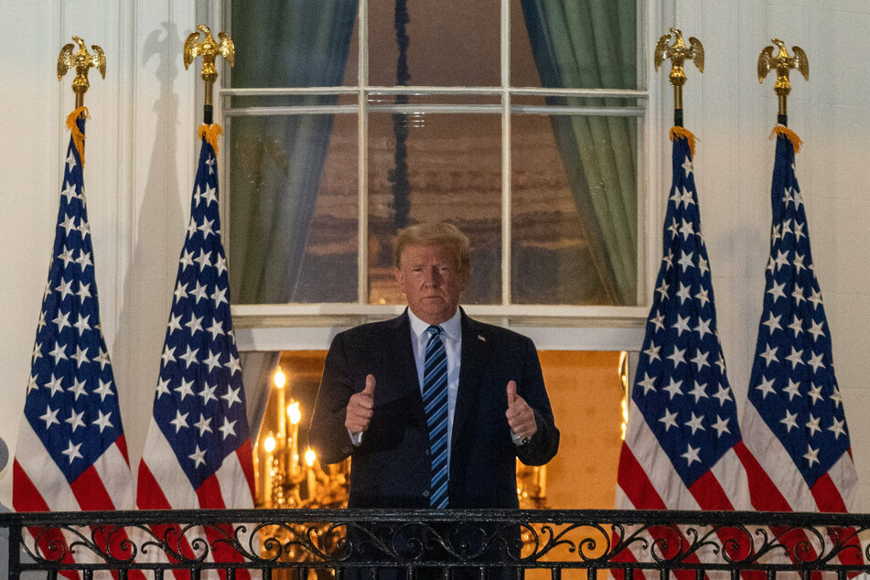 Donald Trump standing on the Truman balcony of the White House.