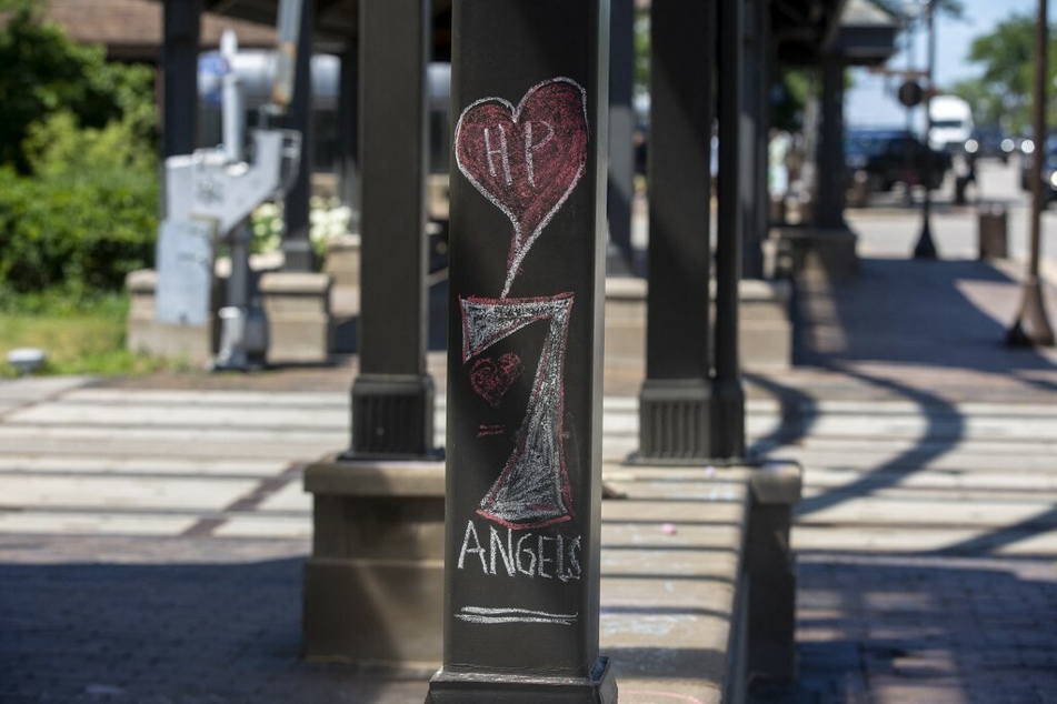 A drawing in Highland Park honors the seven people who died in the July 4 shooting.