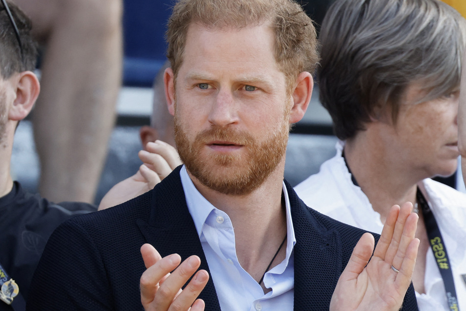 Prince Harry will visit the UK next month to celebrate the anniversary of the Invictus Games, but it's unclear whether his wife will accompany him.