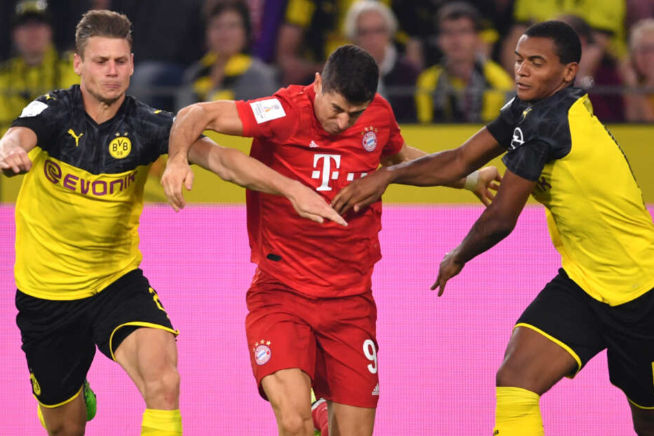 Robert Lewandowski (M.) und seine Teamkollegen vom FC Bayern München stehen unter Druck.