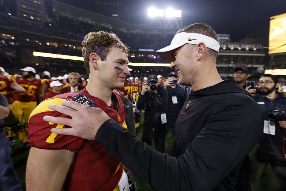 USC head coach Lincoln Riley (r.) appears to have found his next Heisman-worthy quarterback in Miller Moss after a historic performance in the Holiday Bowl.