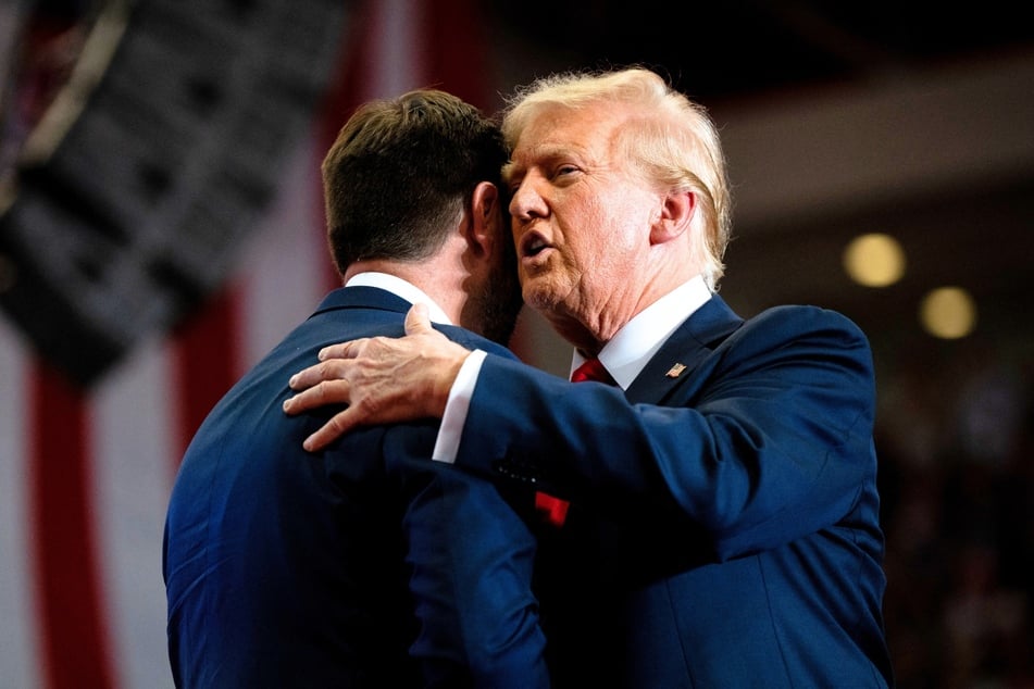 JD Vance (l.) introducing Donald Trump during a rally at Herb Brooks National Hockey Center on July 27, 2024, in St Cloud, Minnesota.