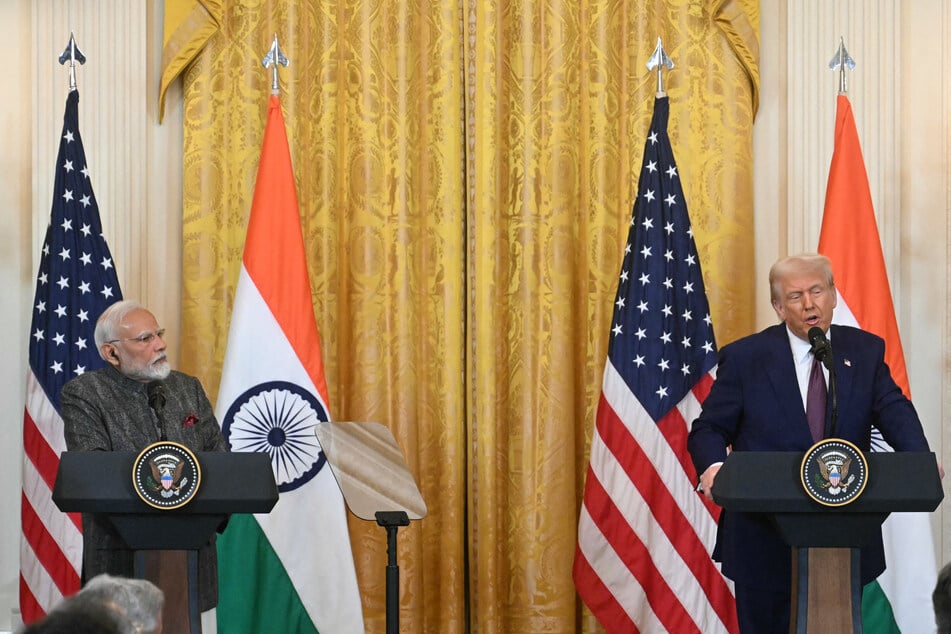Indian Prime Minister Narendra Modi (l.) listens to US President Donald Trump during a press conference in the East Room of the White House on February 13, 2025.