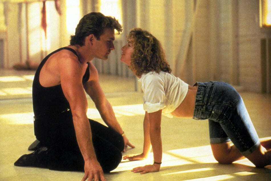 Dirty Dancing follows a dance instructor, Patrick Swayze (l) who falls in love with a guest, Jennifer Grey (r).