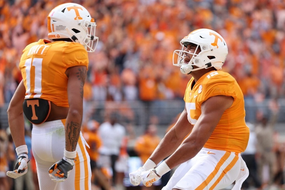 Wide receiver Jalin Hyatt (l) and wide receiver Bru McCoy of the Tennessee Volunteers celebrate after a huge touchdown score against Alabama at home in the Neyland stadium.