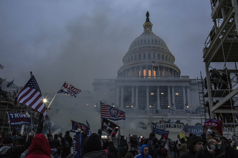 Security forces respond with tear gas after pro-Trump mob breached the US Capitol on January 6.