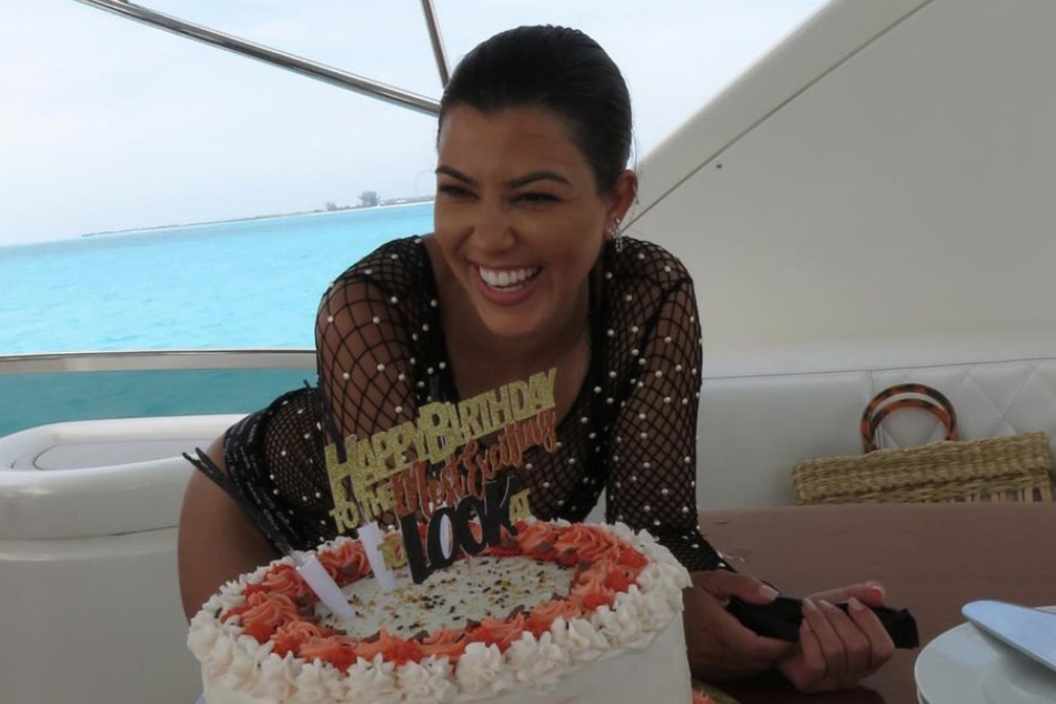 Kourtney Kardashian launched her birthday festivities with friends, cake, and a yacht while also throwing a little shade at her sister!