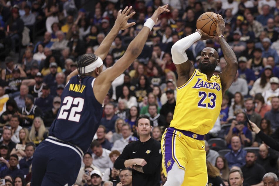 LeBron James of the Los Angeles Lakers shoots and scores against Zeke Nnaji of the Denver Nuggets to become the NBA's all-time field goal leader during the first quarter at Ball Arena on March 5, 2026.