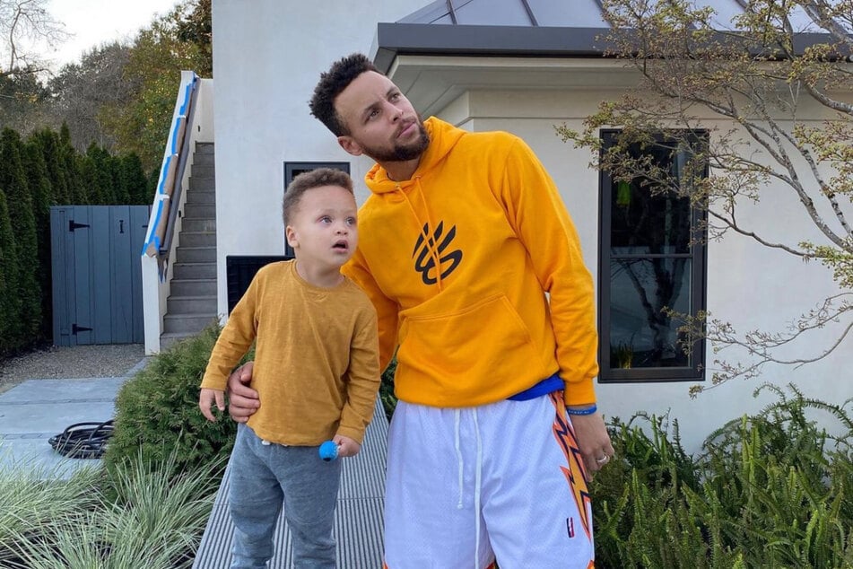 Stephen Curry and son Canon looking upon the blue skies in sunny California.
