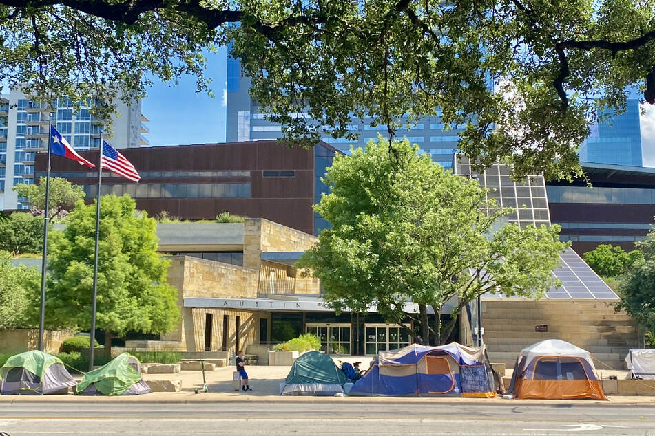 Several tents remained in front of Austin City Council on Monday as government officials and law enforcement began the citation process of Phase Two.