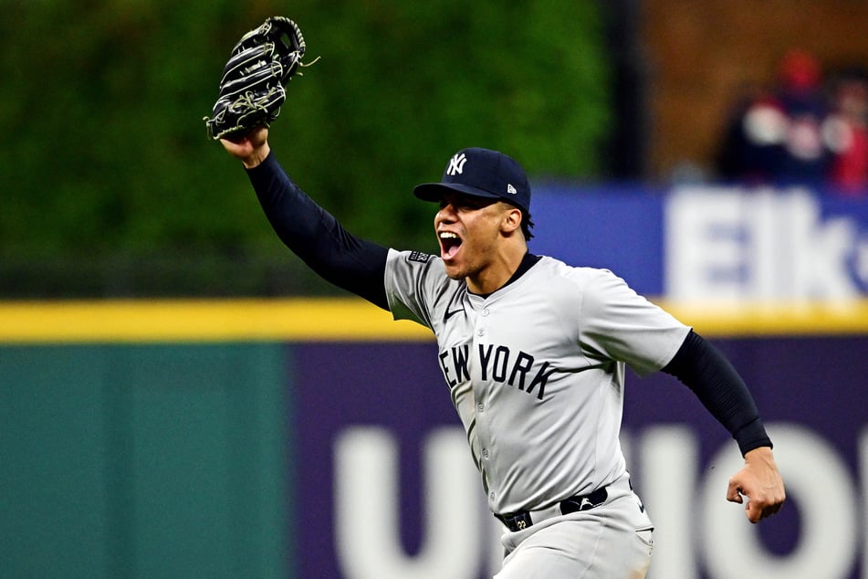 New York Yankees outfielder Juan Soto celebrates after making the final out to beat the Cleveland Guardians during game five of the ALCS for the 2024 MLB playoffs at Progressive Field.