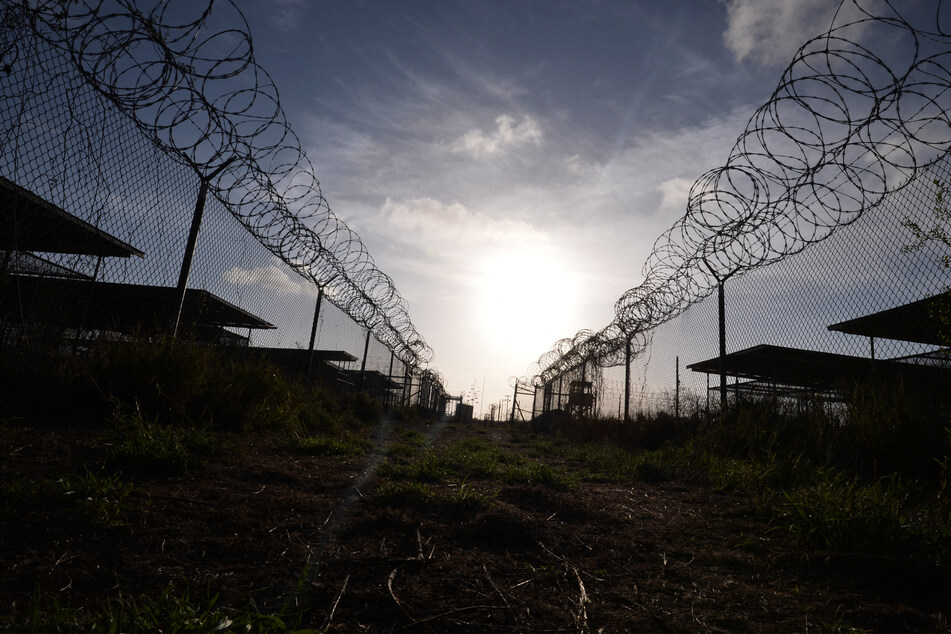 The first US flights carrying detained migrants to America's notorious Guantanamo military base in Cuba were underway Tuesday.