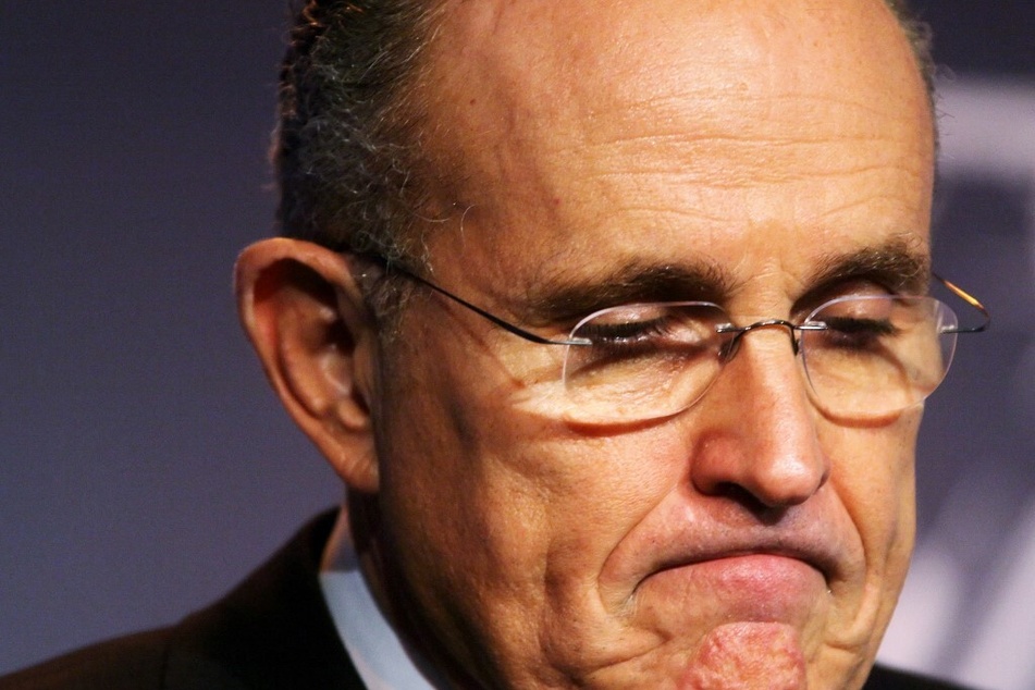 A former associate of Rudy Giuliani sued the ex-New York mayor for $10 million, alleging he subjected her to "wide-ranging sexual assault and harassment."