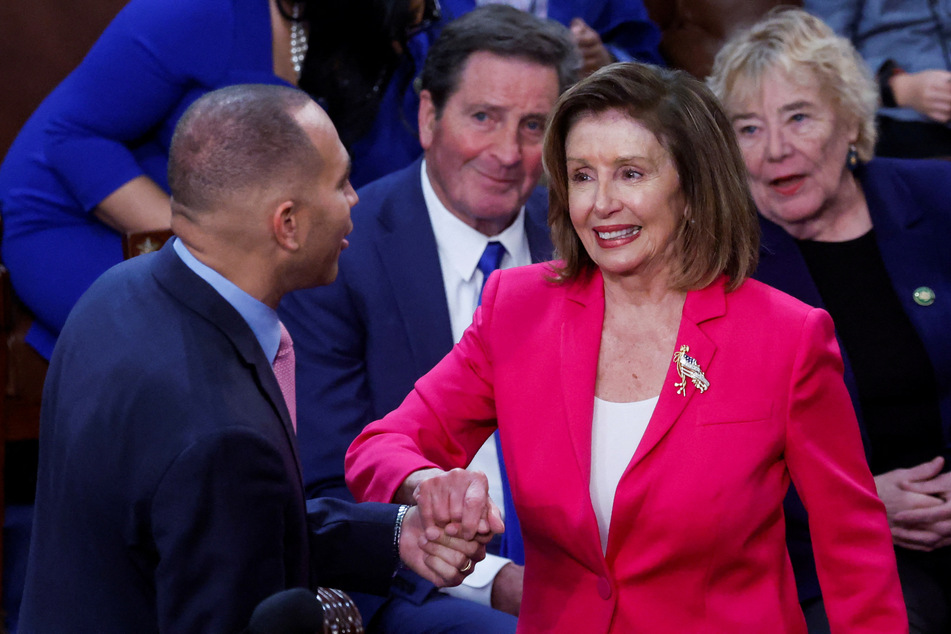 Incoming Democratic Leader Rep. Hakeem Jeffries greets outgoing House Speaker Nancy Pelosi inside the House Chamber on the first day of the 118th Congress.