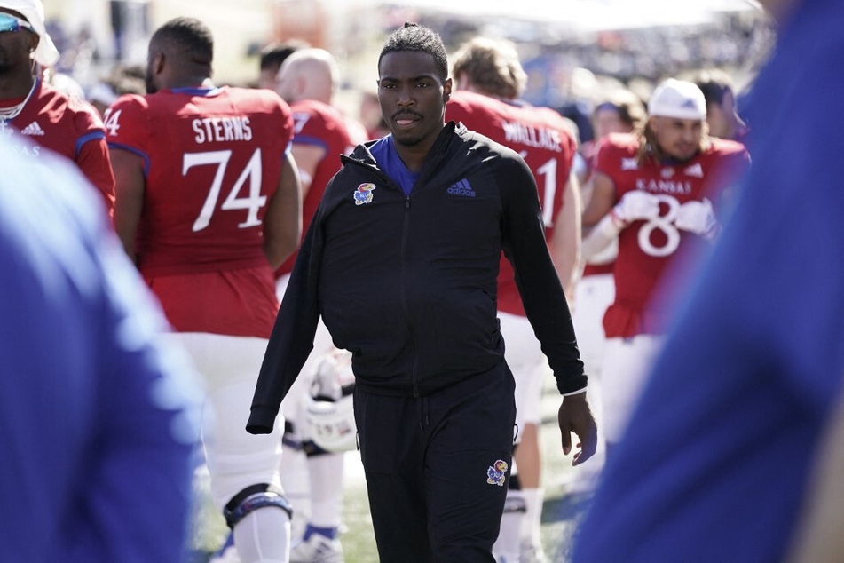 Quarterback Jalon Daniels of the Kansas Jayhawks walks the sideline in the second half during a game against the TCU Horned Frogs at David Booth Kansas Memorial Stadium.