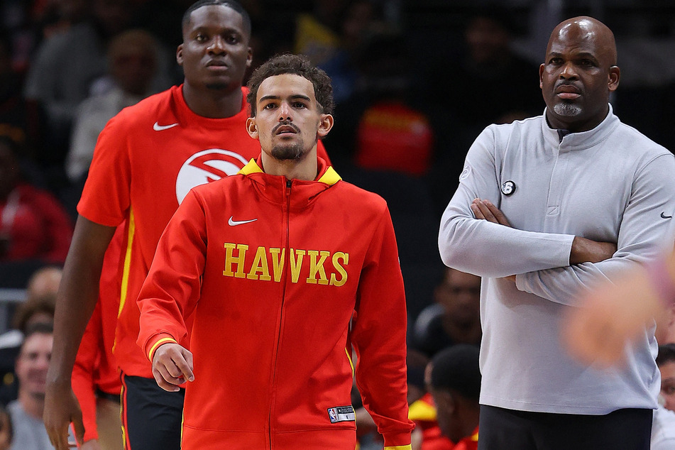 With head coach Nate McMillan (r.) gone, Trae Young's Atlanta Hawks are in turmoil.