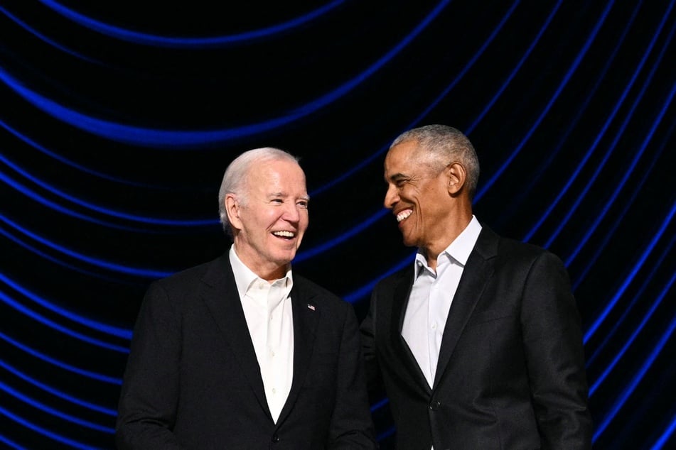 President Joe Biden (l.) laughs with former President Barack Obama (r.) onstage during a campaign fundraiser at the Peacock Theater in Los Angeles on June 15, 2024.