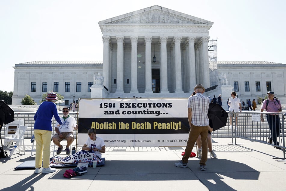 Activists with the Abolitionist Action Committee stand outside of the US Supreme Court Building on July 2, 2024 in Washington, DC.