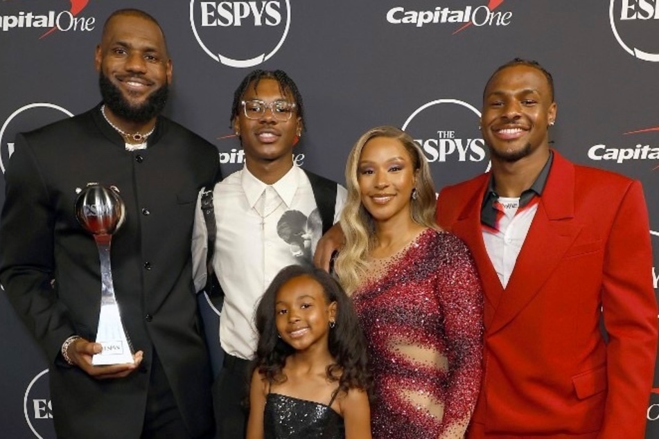 Parents LeBron (l.) and Savannah James are reportedly both positive and feeling calmer about their son Bronny James' health.