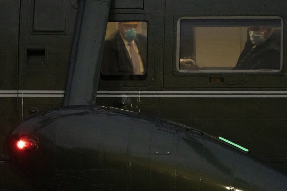 Trump in the chopper on his way back to the White House.
