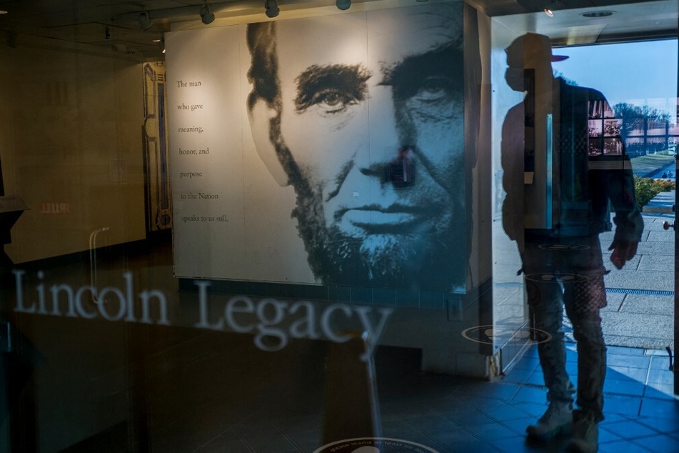An image of Abraham Lincoln honors the former president inside the Lincoln Memorial in Washington DC.