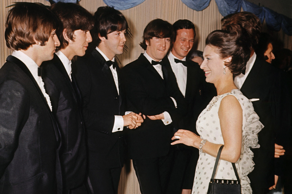 The Beatles (l. to r.): Ringo Starr, George Harrison, Paul McCartney, and John Lennon meeting with Britain's Princess Margaret, the younger sister of Britain's Queen Elizabeth II, in July 1965.